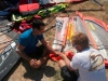 Sail repair at a event site before racing...